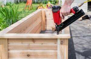 Person making DIY garden planters